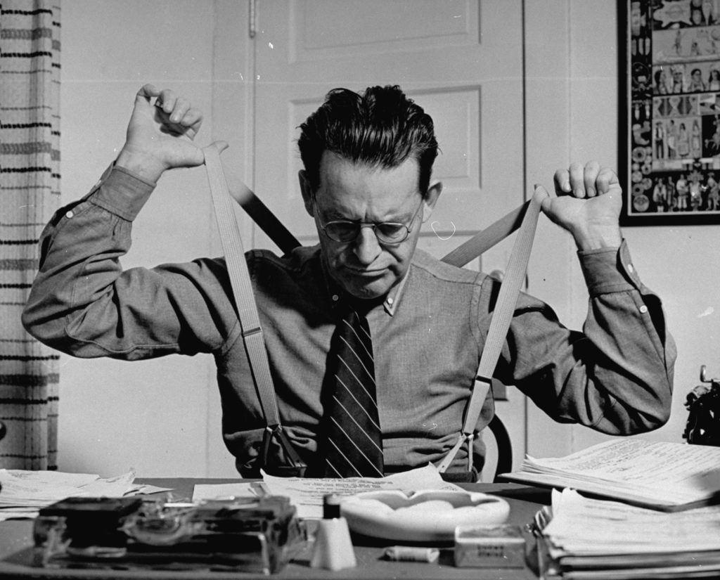 Screenwriter Jack Cunningham snapping suspenders as he works on Harold Lloyd's new film. (Photo by Paul Dorsey/The LIFE Picture Collection © Meredith Corporation)