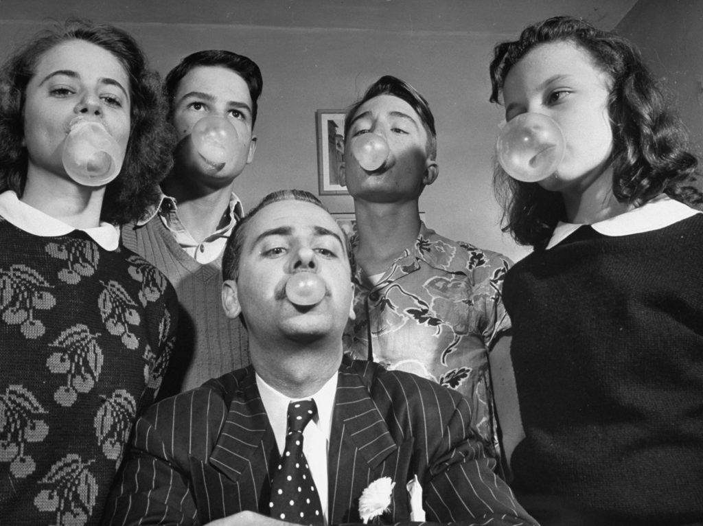 Bubble Gum King Andrew J. Paris blowing bubbles with high school students. (Photo by Cornell Capa/The LIFE Picture Collection © Meredith Corporation)