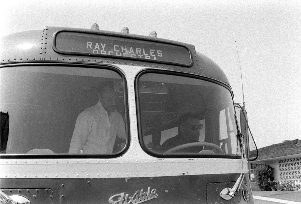 Ray Charles and his sons goof around on his tour bus, 1966.