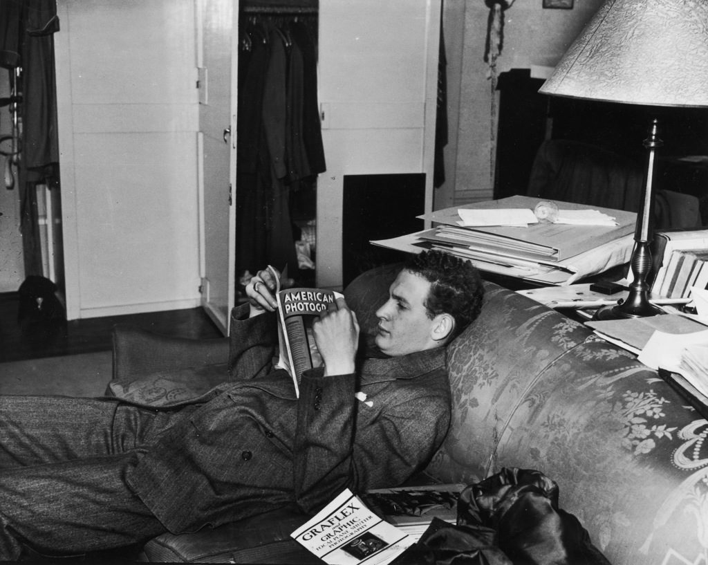 Charles Steinheimer reading a copy of American Photography. (Photo by Iro Harper/The LIFE Images Collection)