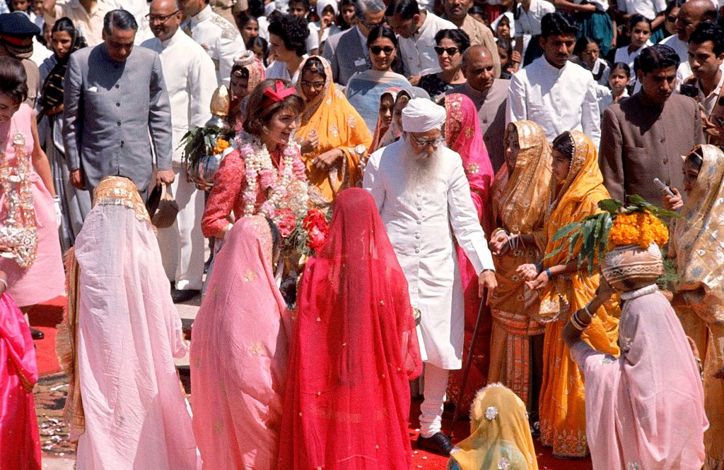 First Lady Jackie Kennedy is greeted by Gov. Gurmukh Nihal Singh, center, at Jaipur Airport in March 1962.