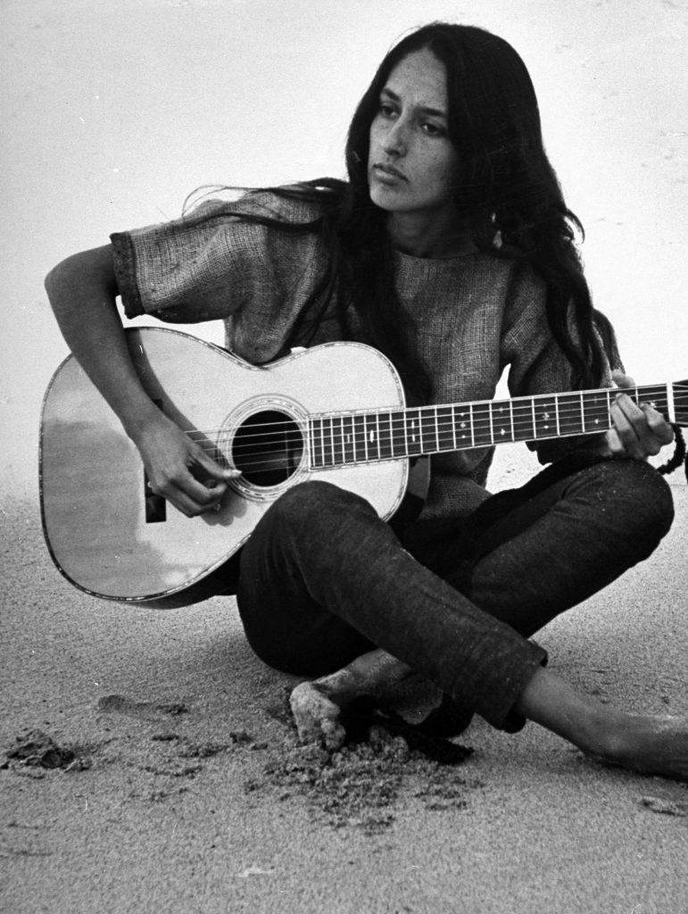 Folk singer Joan Baez on the beach near her home in Carmel, California, in 1962.