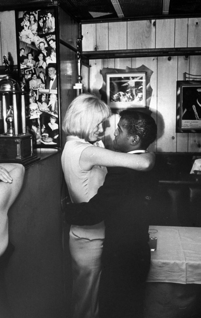 Sammy Davis Jr. with wife May Britt, 1964.