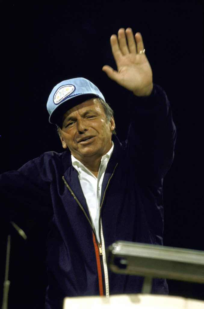 Frank Sinatra waves at the camera during a rehearsal for a MPTRF benefit, 1971.