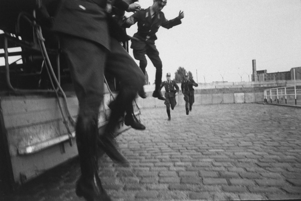 West Three West Berlin police officers get ready to start their shifts on guard duty at the Berlin Wall.