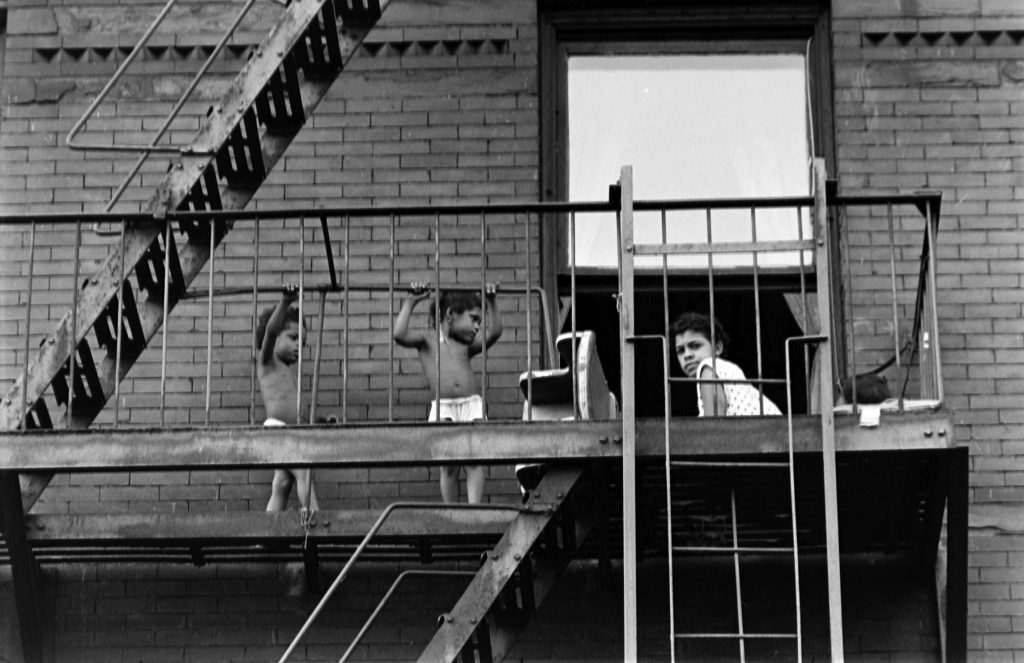 People spending time outdoors during an ongoing heatwave during the summer of 1953 in New York City.