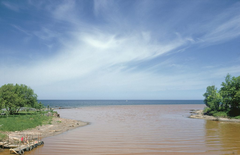 Color photos of pollution in the Great Lakes in 1968.