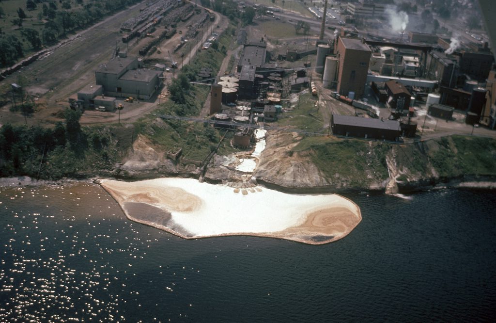 Color photos of pollution in the Great Lakes in 1968.