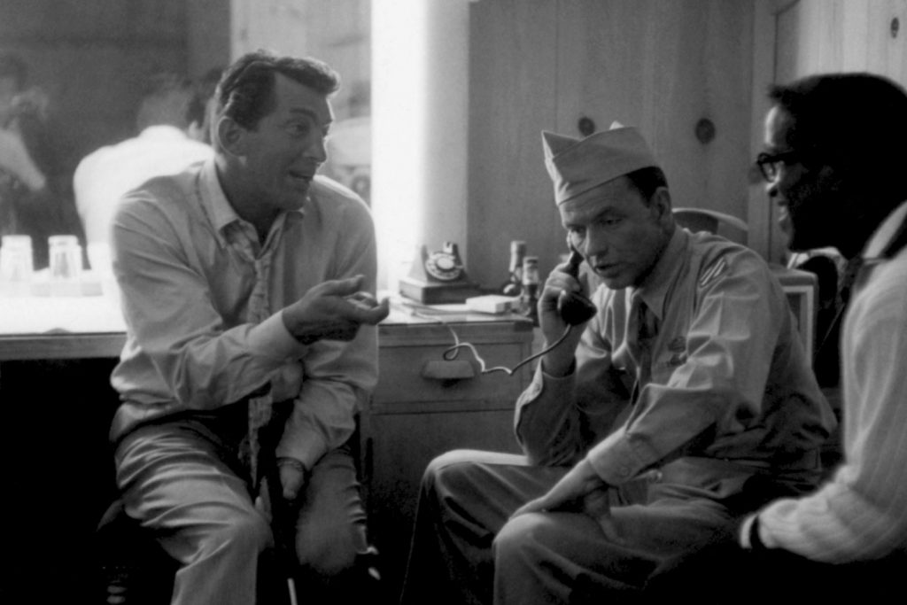 Sammy Davis Jr. visits Frank Sinatra and Dean Martin at MGM Studios, where the duo were making Some Came Running in 1958.