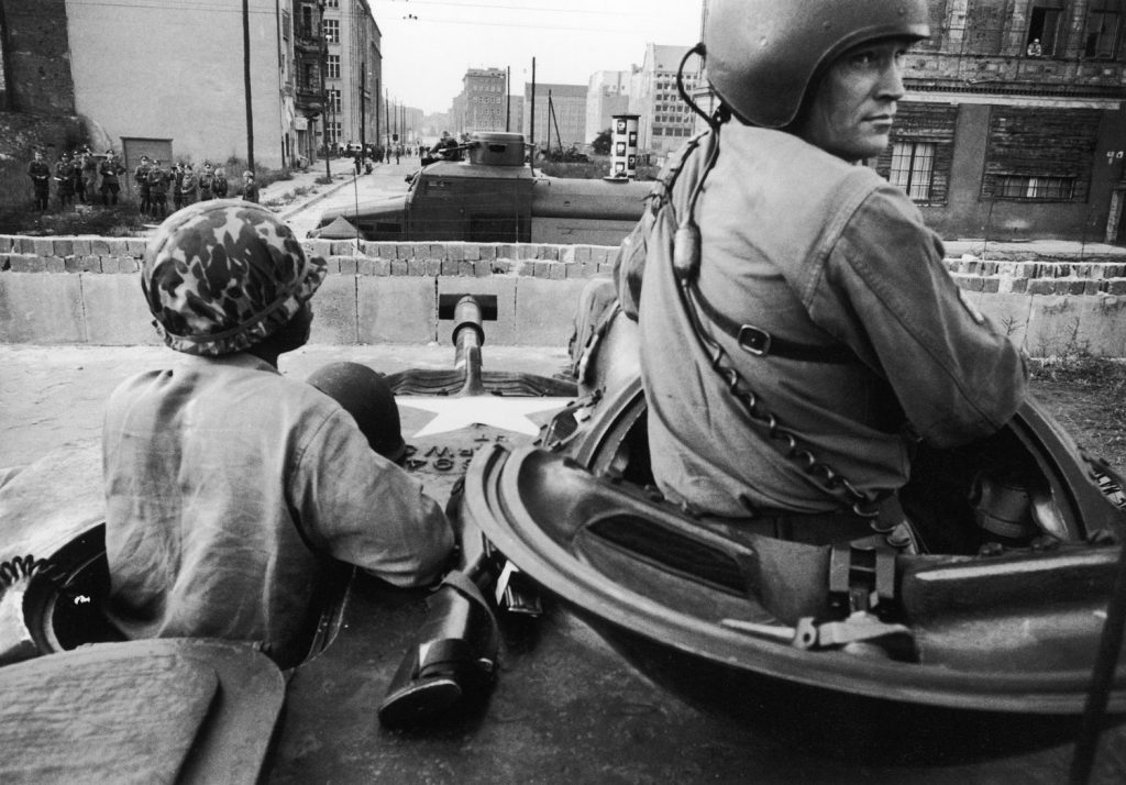 U.S. and East German forces face each other across the newly built Berlin Wall