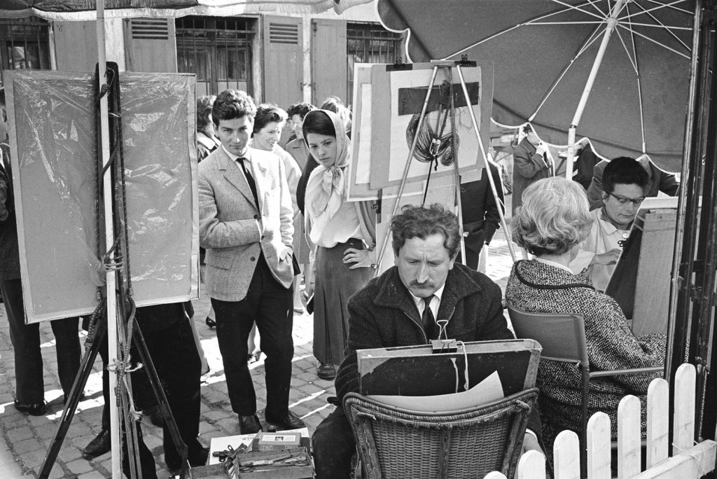 Street artists at work, Paris, 1963.