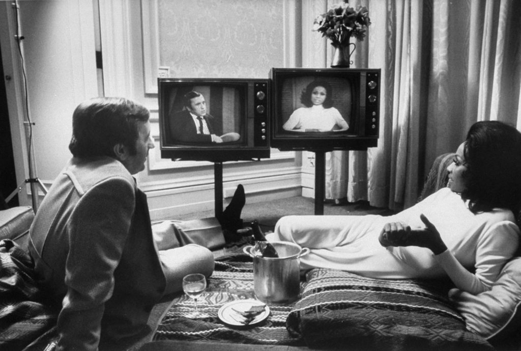 David Frost and Diahann Carroll (who were once engaged, but never married) watch themselves as they appear on two different talk shows, 1972.