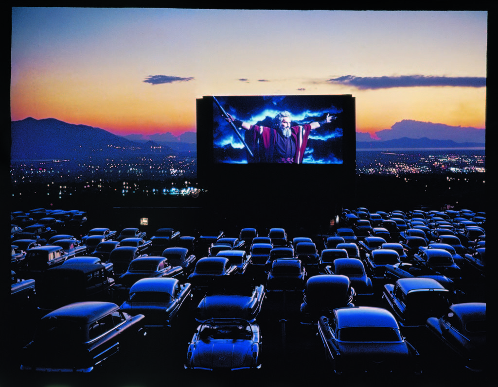 Actor Charlton Heston as Moses with his arms flung wide while appearing in the motion picture, "The Ten Commandments", as it is shown at drive-in movie theater. (Photo by J.R. Eyerman/The LIFE Picture Collection © Meredith Corporation)