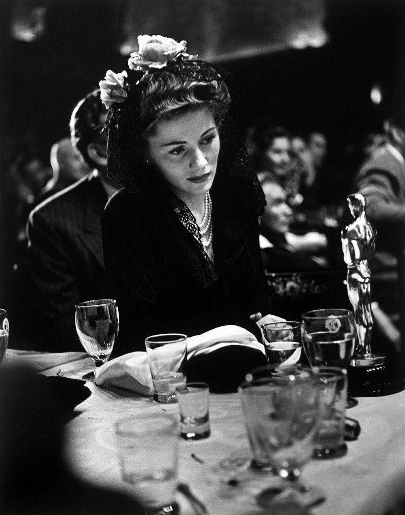 Joan Fontaine looking at the Best Actress Oscar she won for her role in the film "Suspicion." (Photo by Peter Stackpole/The LIFE Picture Collection © Meredith Corporation)