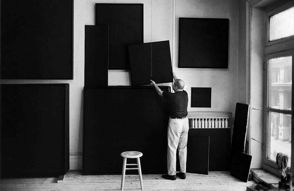 American artist Ad Reinhardt hangs his paintings to dry in a studio, New York, New York, 1966.(Photo by John Loengard/The LIFE Picture Collection © Meredith Corporation)