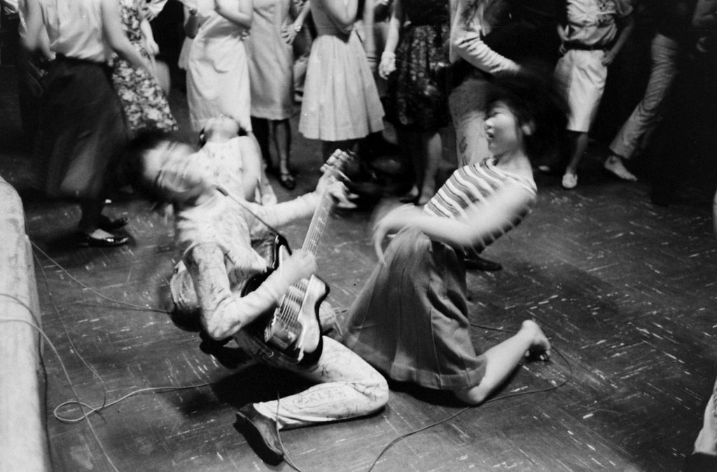 A fan (right) and a "Tokyo Beatle," 1964.