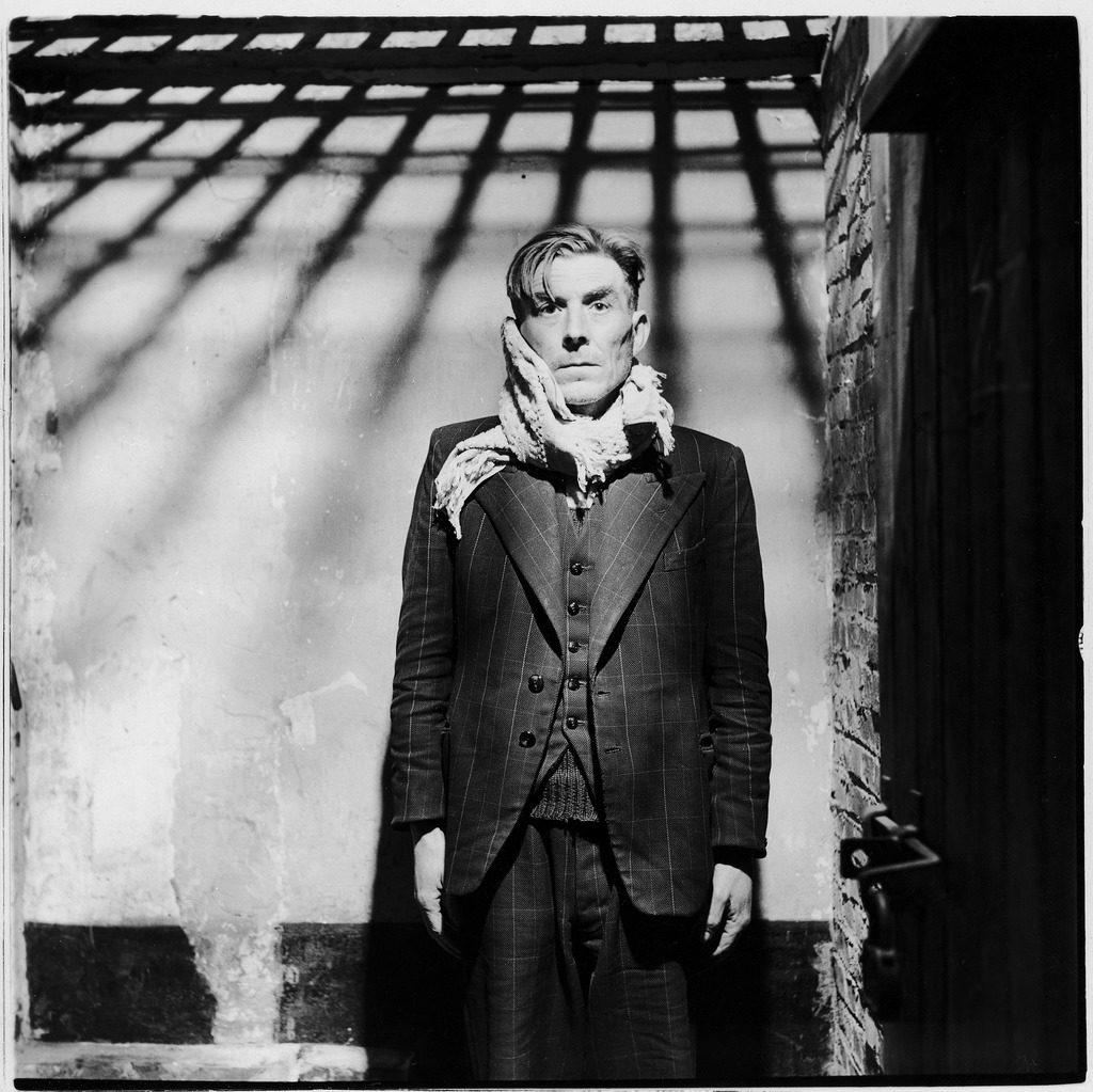 Inside a cell at the notorious Breendonk Nazi prison camp, a former Flemish SS guard is imprisoned after overthrow of German forces. (Photo by George Rodger/The LIFE Picture Collection © Meredith Corporation)