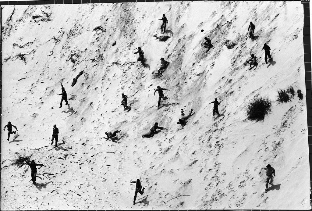 Boy Scouts racing down a dune at the Indiana Dunes. (Photo by Michael Rougier/The LIFE Picture Collection © Meredith Corporation)