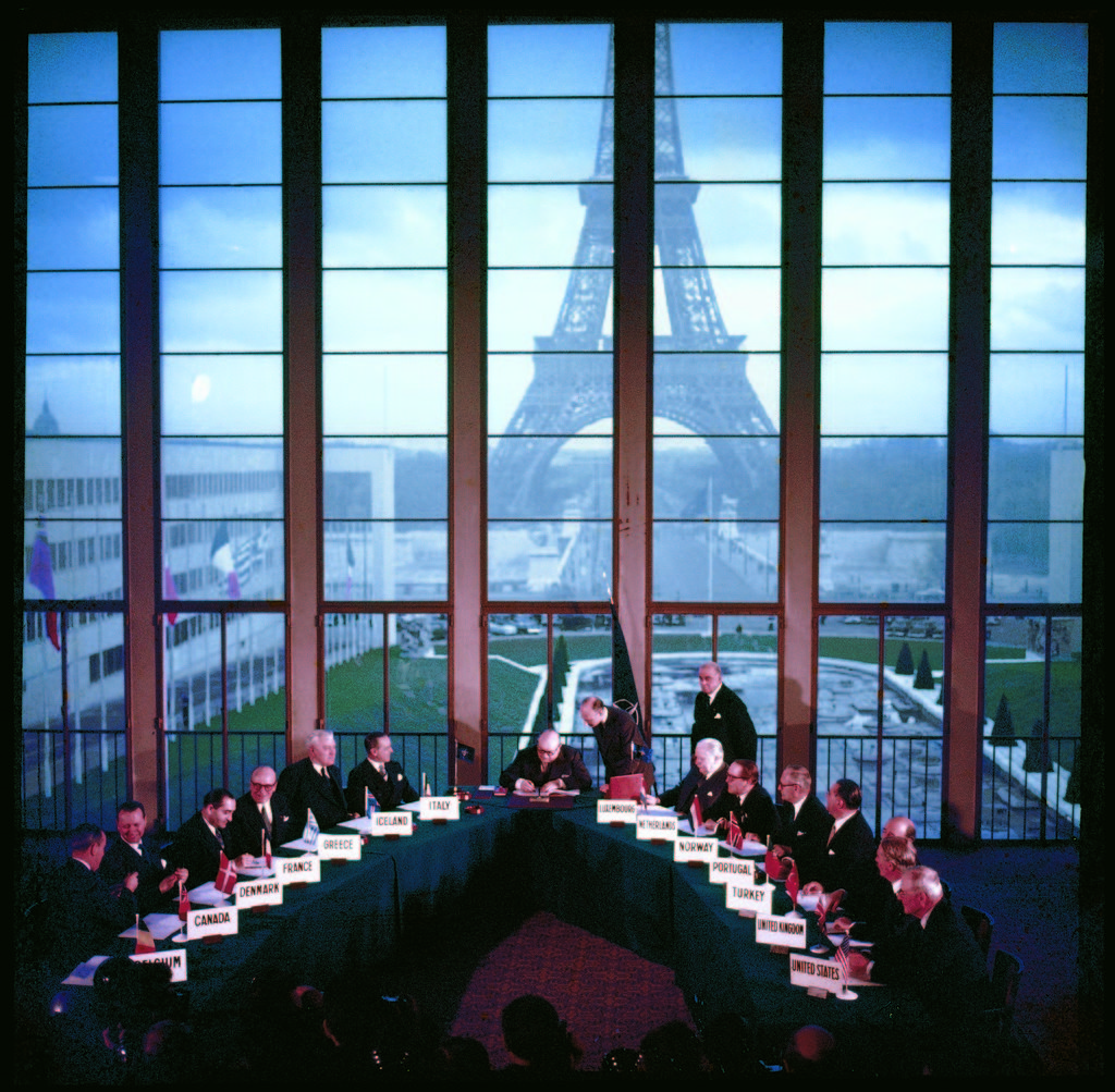 Representatives of 14 NATO nations (including US Secretary of State John Foster Dulles (fore, far R) signing a pact admitting Germany as 15th member in a ceremony at Palais de Chaillot. (Photo by Frank Scherschel/The LIFE Picture Collection © Meredith Corporation)