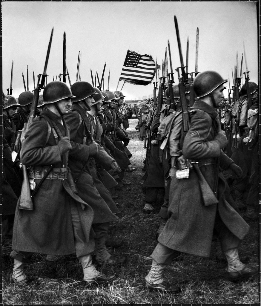 American glider troops' airborne unit on parade at an airfield before Eisenhower's D-Day invasion during WWII. (Photo by Frank Scherschel/The LIFE Picture Collection © Meredith Corporation)