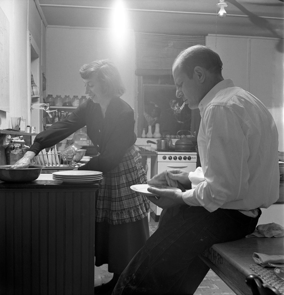 Jackson Pollock dries dishes with Lee Krasner in the kitchen of their farmhouse, 1949.